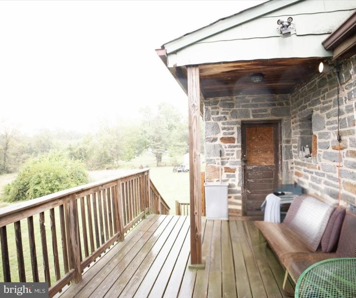 7306 Dogwood Road Baltimore, MD 21244 - Photo 7 of 37 Charming porch with scenic countryside views.