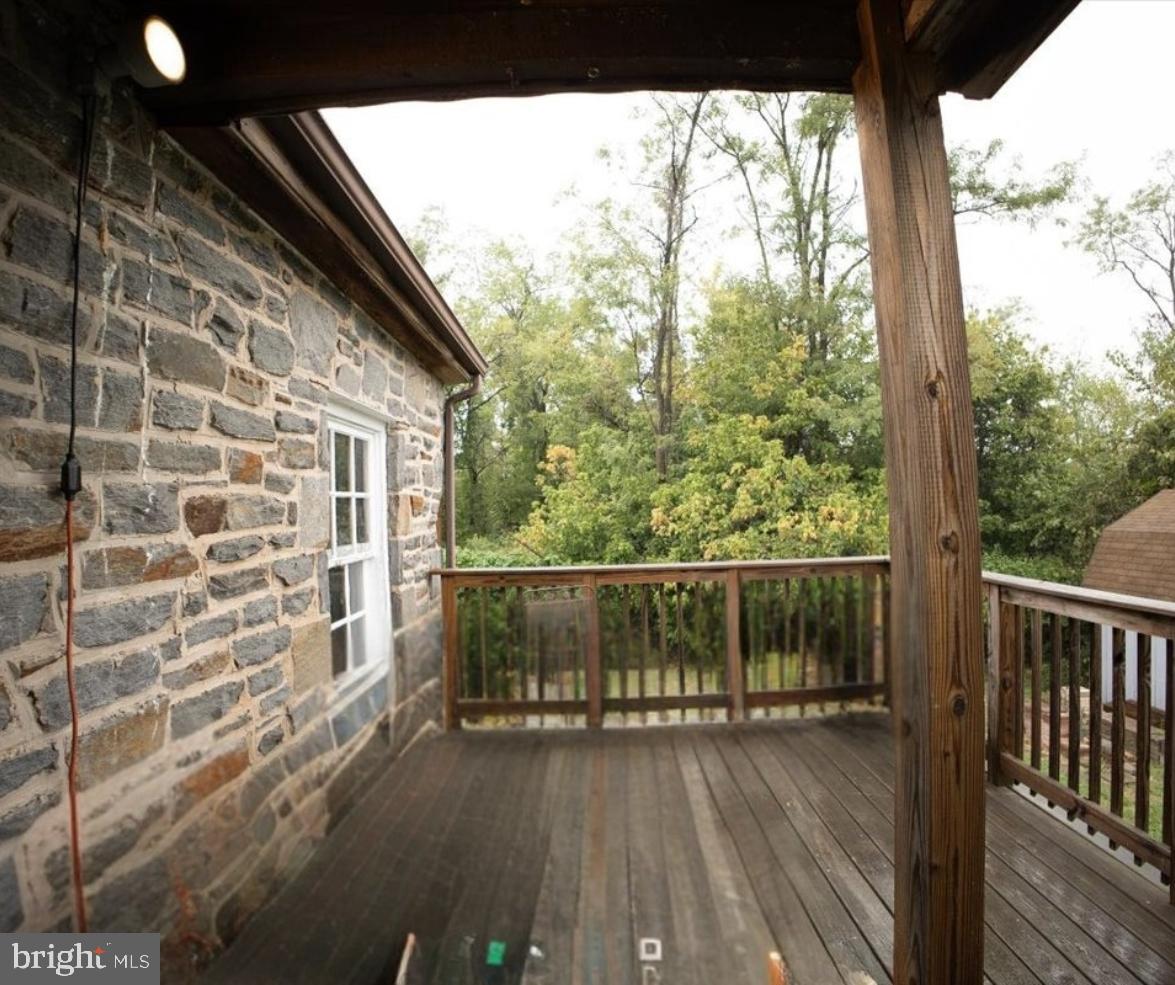 7306 Dogwood Road Baltimore, MD 21244 - Photo 9 of 37 Charming stone exterior with serene views.