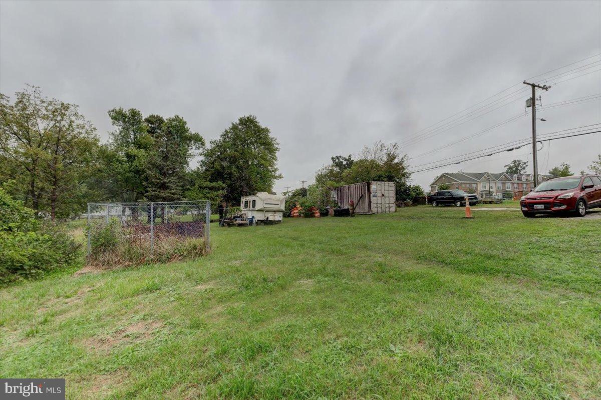 7306 Dogwood Road Baltimore, MD 21244 - Photo 10 of 37 Spacious lot with lush greenery and potential.