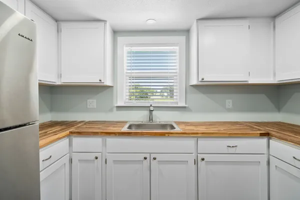 a kitchen with a sink and cabinets
