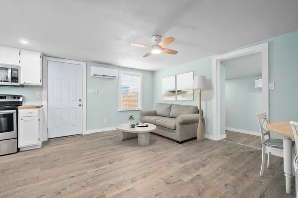 a living room with furniture and a fireplace