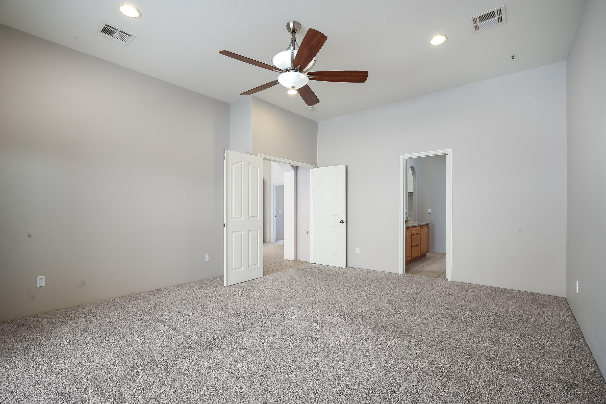 10748 Ocotillo Road Desert Hot Springs, CA 92240 - Photo 11 of 28 an empty room with ceiling fan and closet