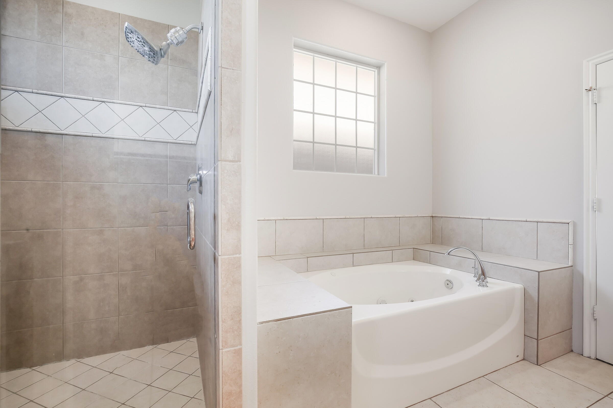 10748 Ocotillo Road Desert Hot Springs, CA 92240 - Photo 15 of 28 a white bath tub and shower