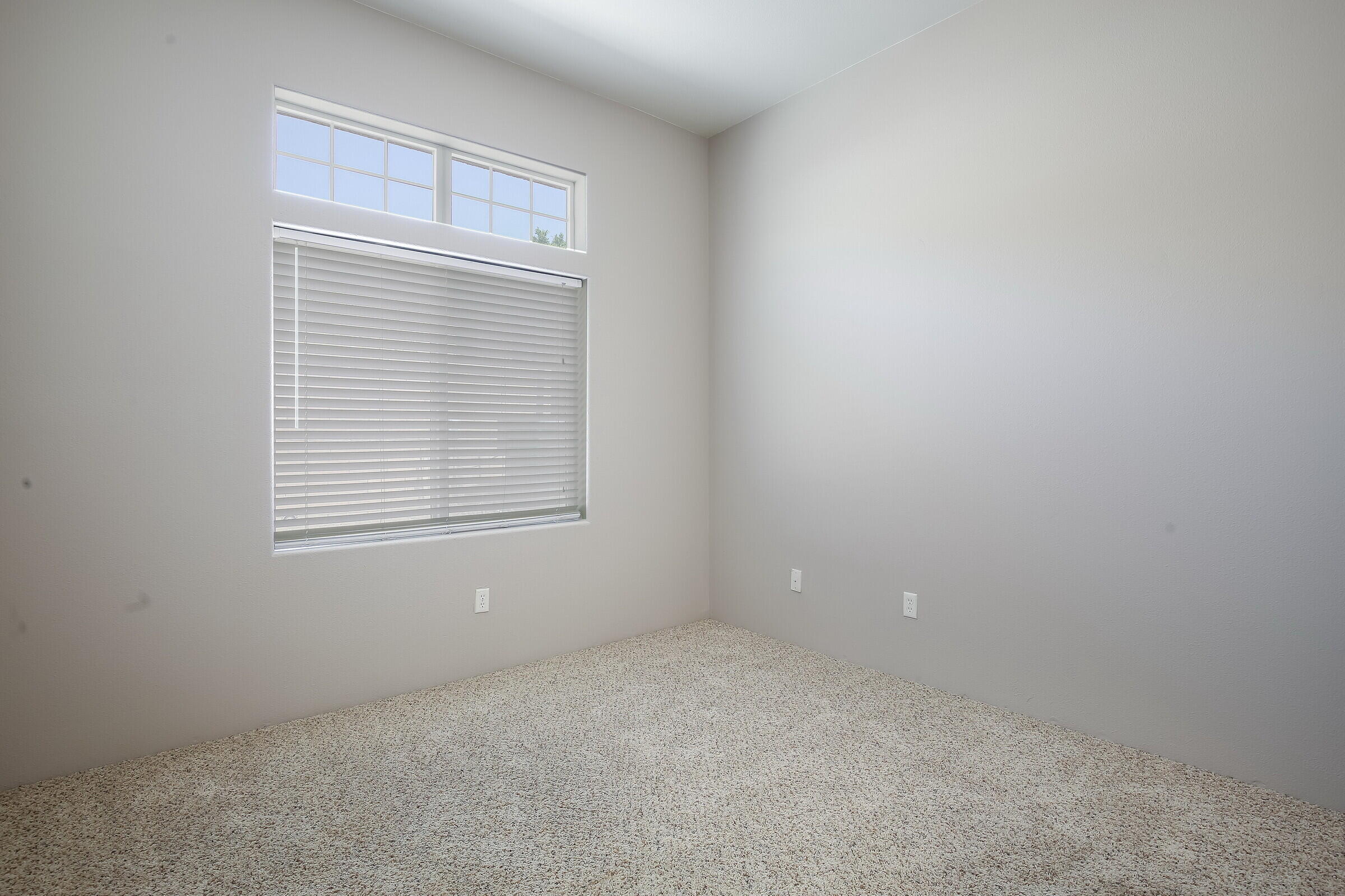10748 Ocotillo Road Desert Hot Springs, CA 92240 - Photo 18 of 28 an empty room with windows
