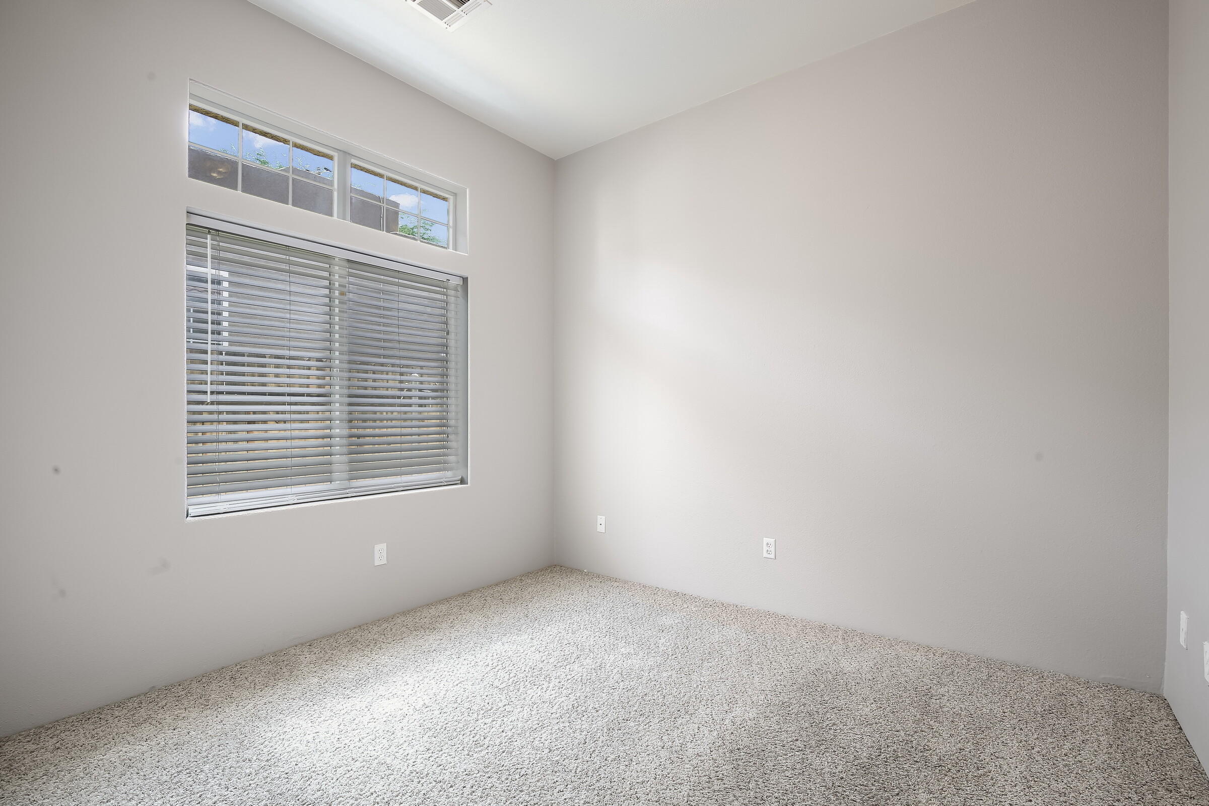 10748 Ocotillo Road Desert Hot Springs, CA 92240 - Photo 20 of 28 a view of an empty room with a window