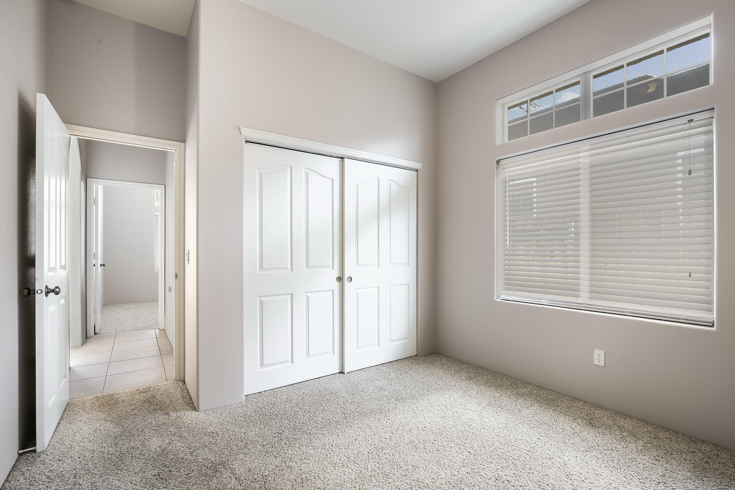 10748 Ocotillo Road Desert Hot Springs, CA 92240 - Photo 21 of 28 a view of an empty room with windows