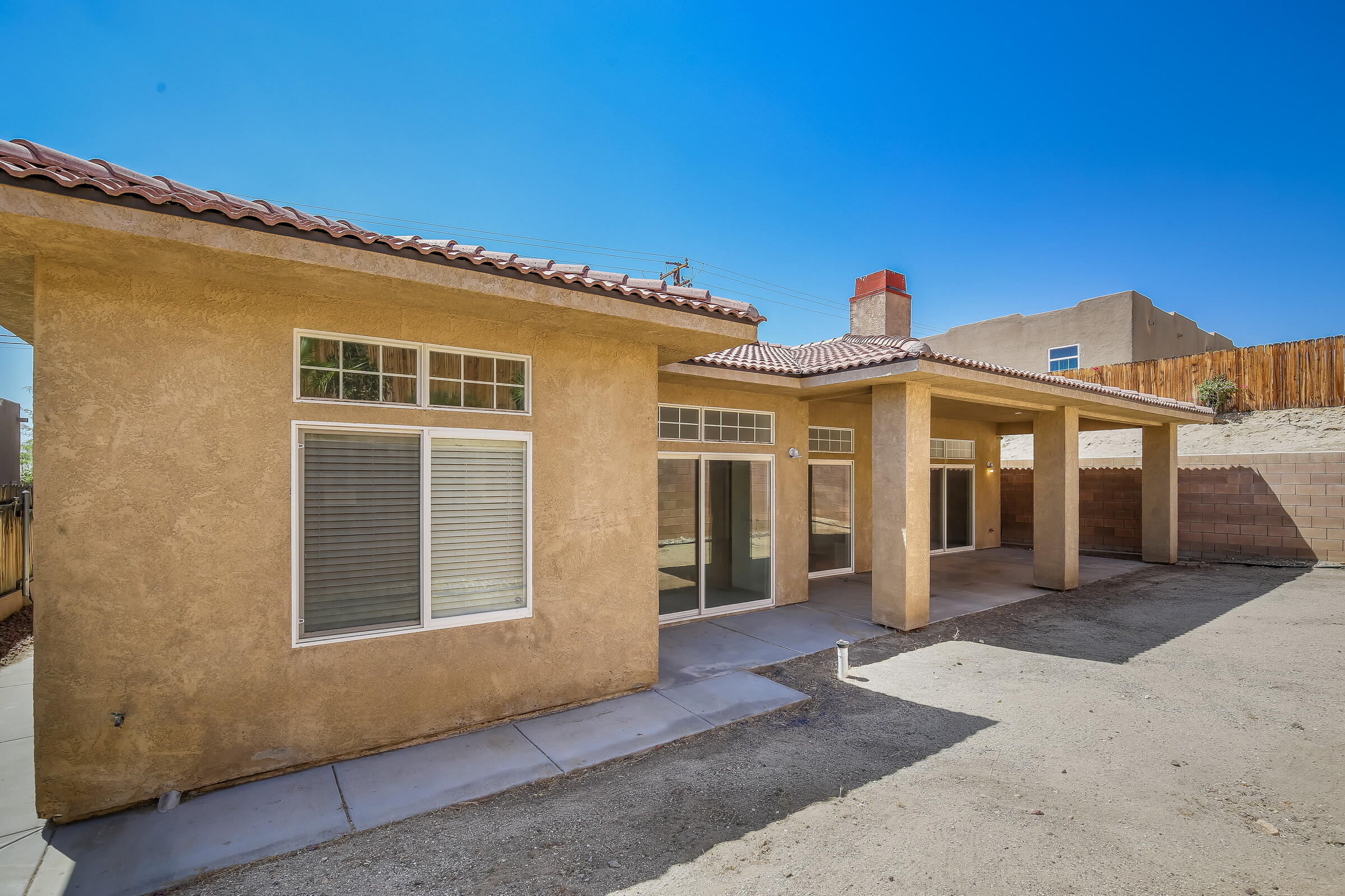 10748 Ocotillo Road Desert Hot Springs, CA 92240 - Photo 23 of 28 a front view of a house with a porch