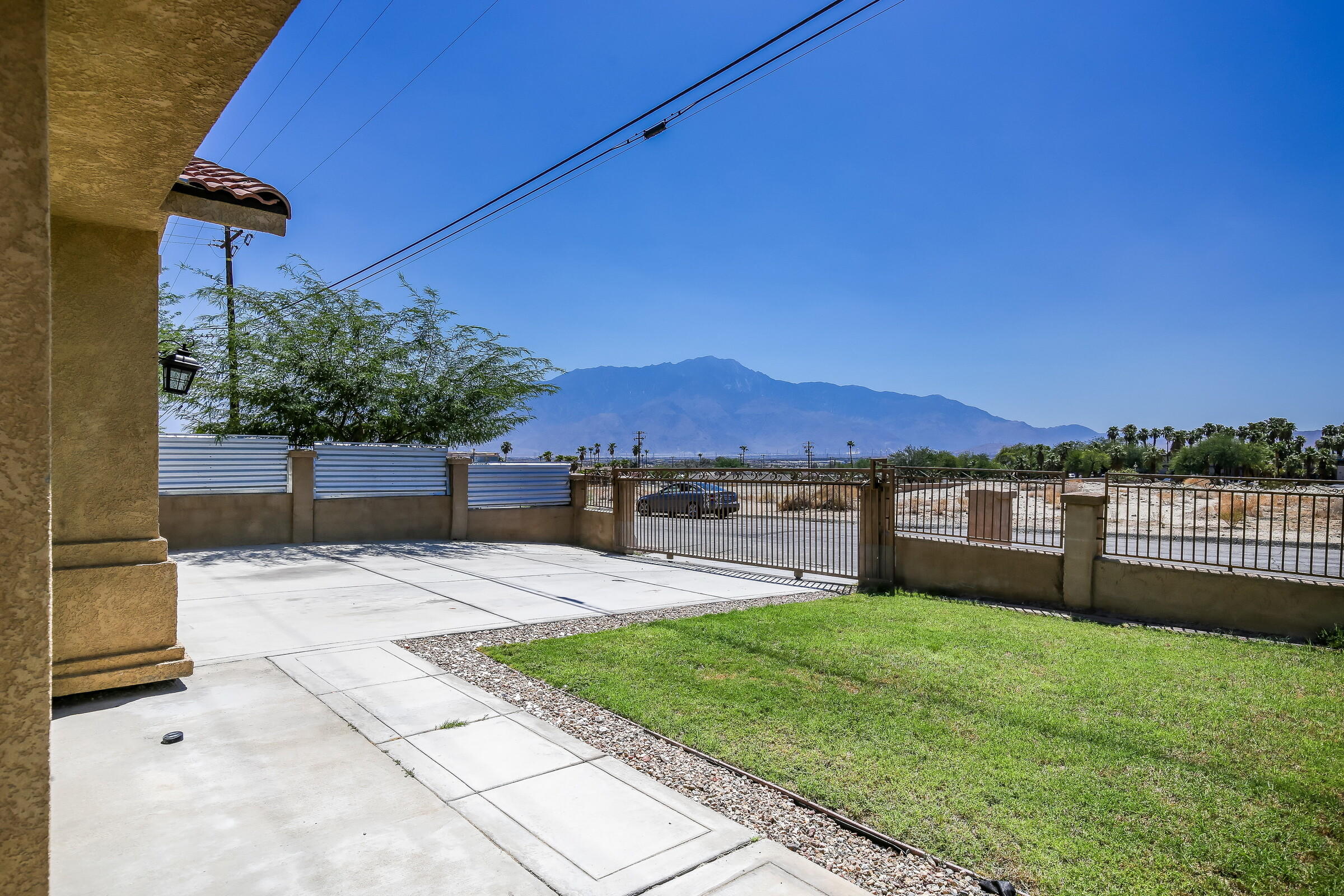 10748 Ocotillo Road Desert Hot Springs, CA 92240 - Photo 28 of 28 a view of a backyard with sitting area