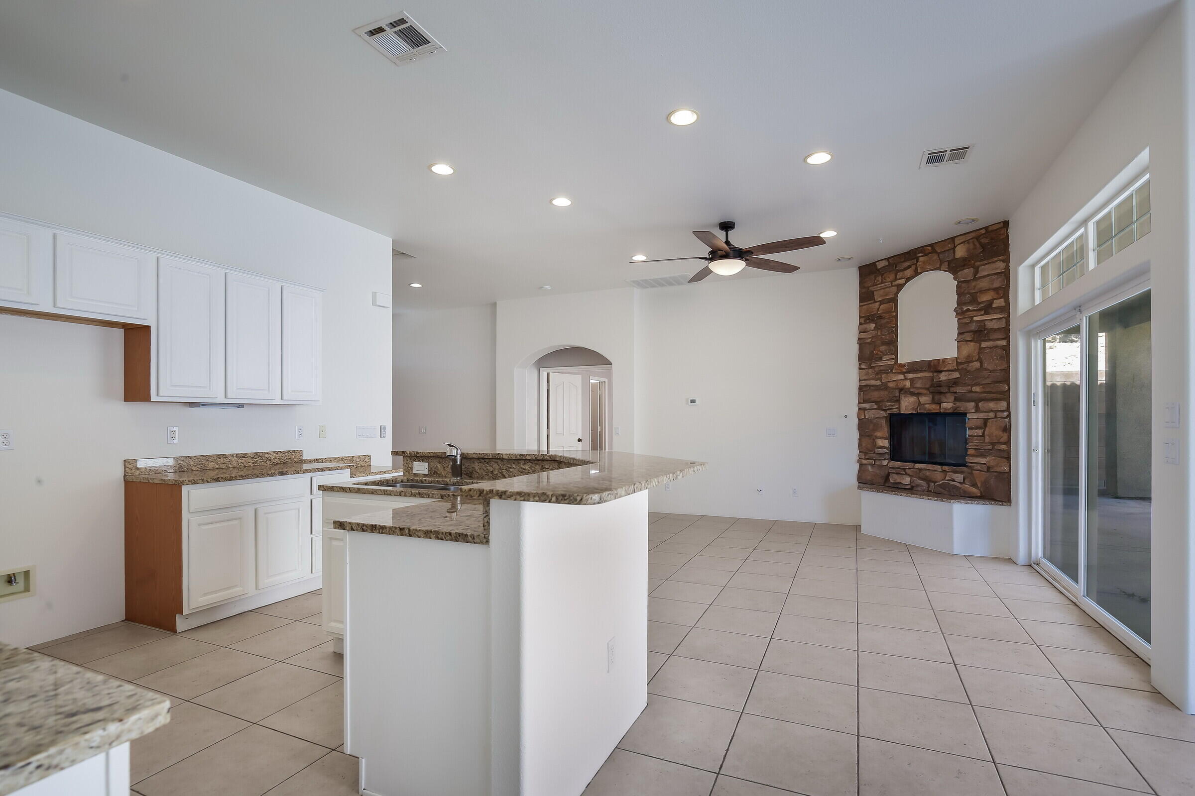 10748 Ocotillo Road Desert Hot Springs, CA 92240 - Photo 4 of 28 a kitchen with stainless steel appliances granite countertop a stove and a sink