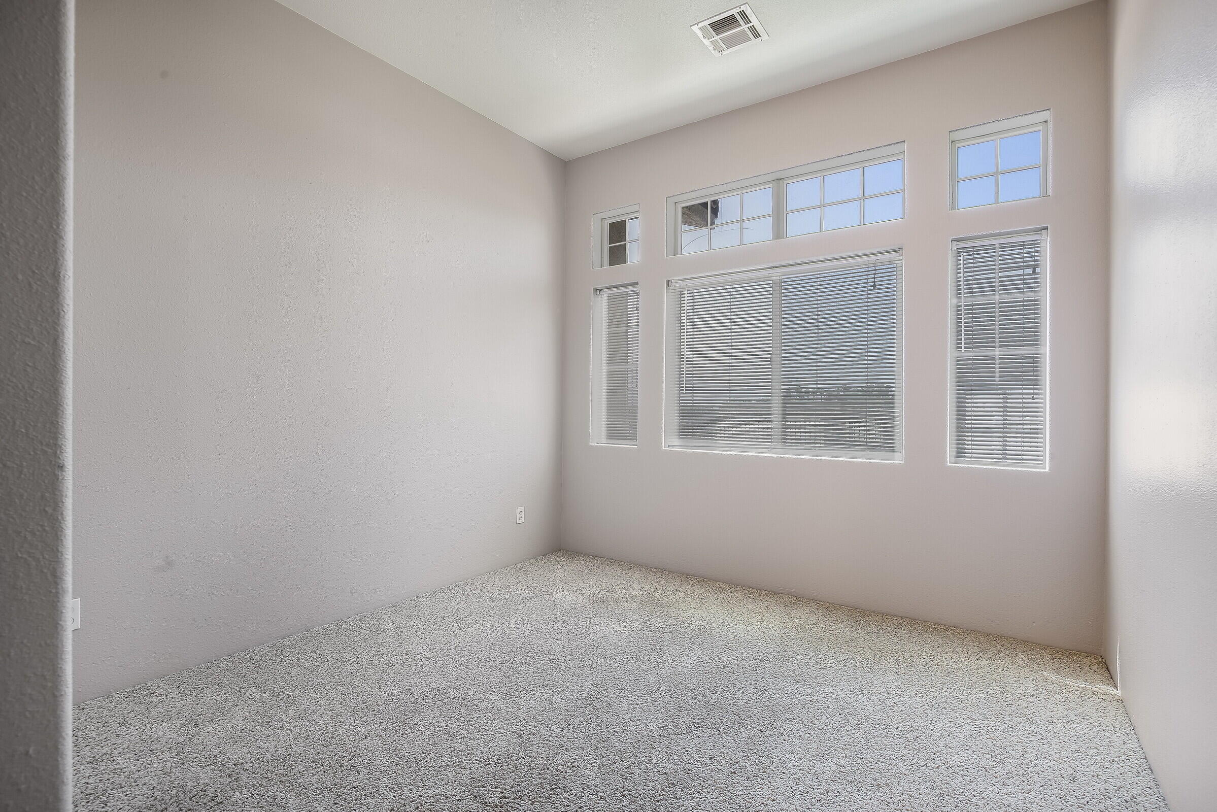 10748 Ocotillo Road Desert Hot Springs, CA 92240 - Photo 8 of 28 a view of an empty room with a window