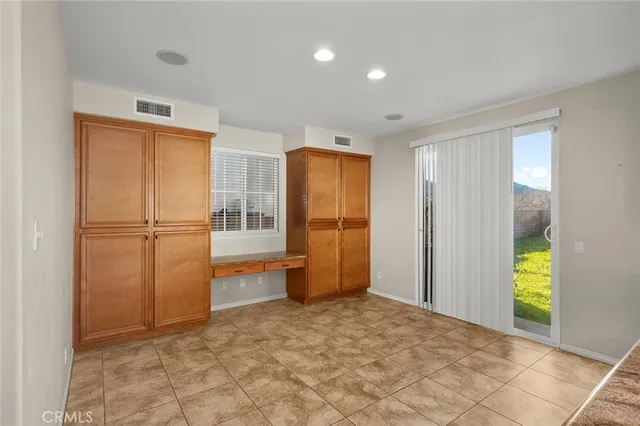 a view of a livingroom with a workspace