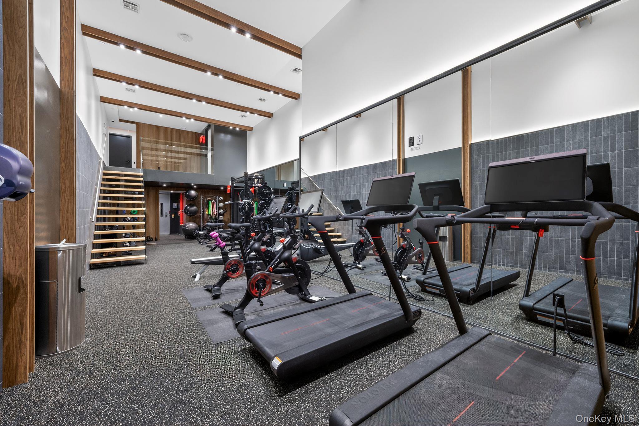 60 West 129th Street, Unit 409 Manhattan, NY 10027 - Photo 12 of 17 a view of a room with gym equipment