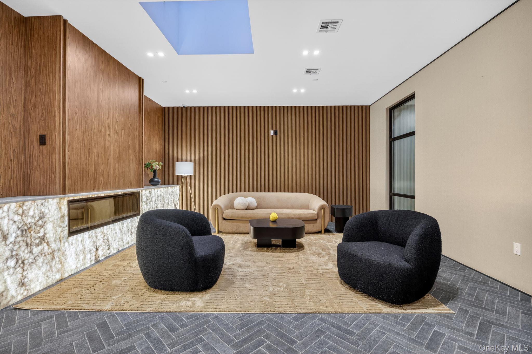 60 West 129th Street, Unit 409 Manhattan, NY 10027 - Photo 14 of 17 a living room with furniture and a mirror