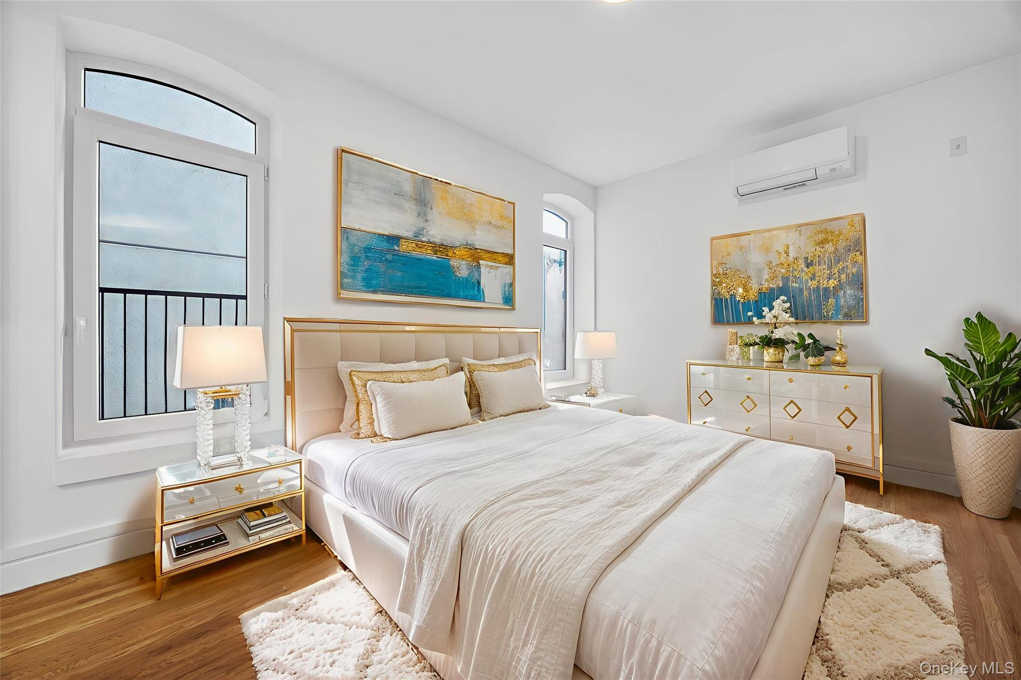 60 West 129th Street, Unit 409 Manhattan, NY 10027 - Photo 6 of 17 a bedroom with a bed a couch and a window