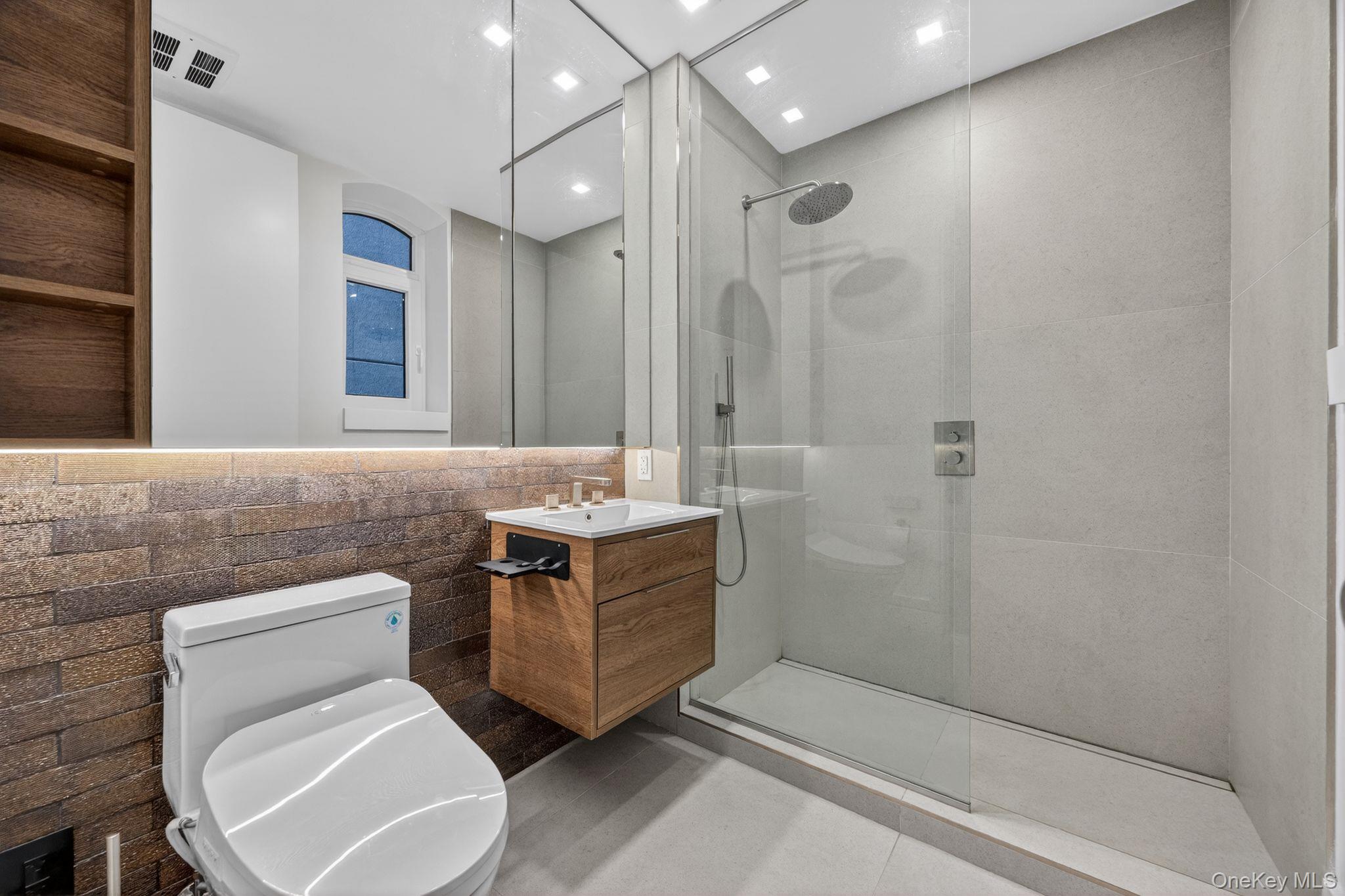 60 West 129th Street, Unit 409 Manhattan, NY 10027 - Photo 9 of 17 a bathroom with a toilet sink and shower