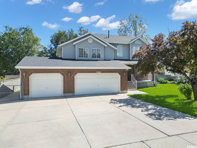 8121 Partridge View Lane West Jordan, UT 84088 - Photo 1 of 1 View of front property featuring a front lawn
