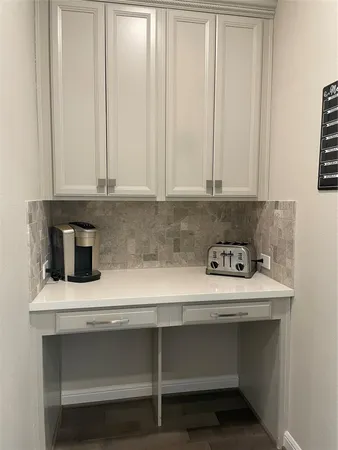 a view of washer and dryer with kitchen countertops