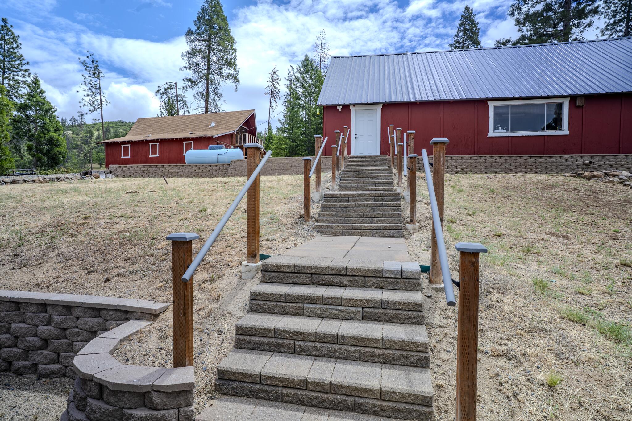 1969 Colestin Road Ashland, OR 97520 - Photo 50 of 72 a front view of a house with wooden stairs