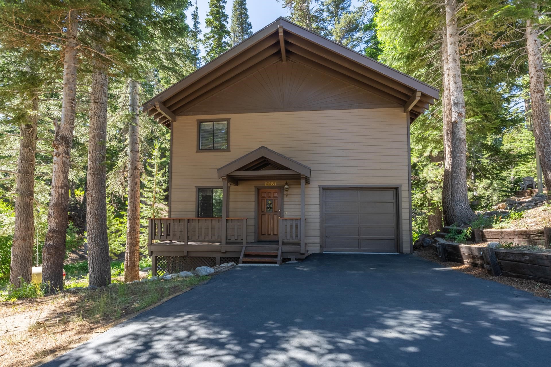 2281 Old Mammoth Road Mammoth Lakes, CA 93546 - Photo 27 of 27 View of front of home featuring asphalt driveway, a garage, and a wooden deck