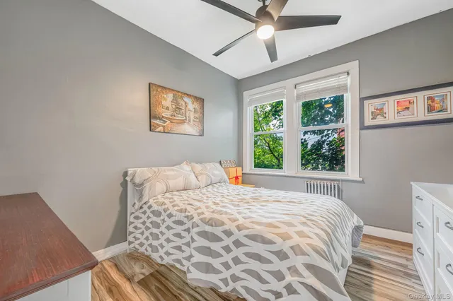 a bedroom with a large bed and a window