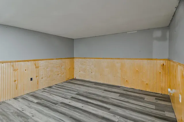 a view of a house with a big yard and sitting area