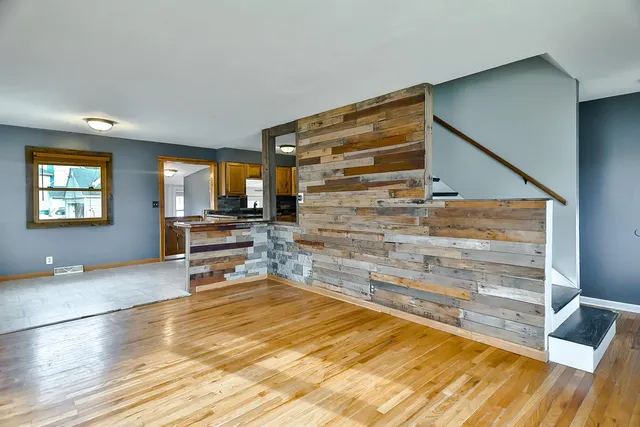 a view of room with wooden floor and chair
