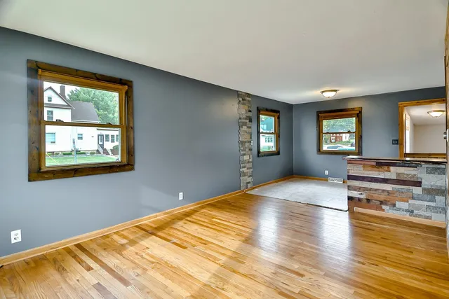 a bedroom with a bed and a view of kitchen