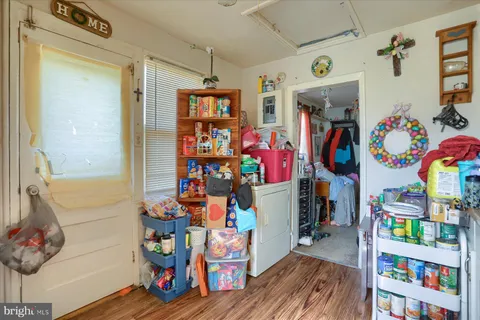 a view of play room with furniture and toys