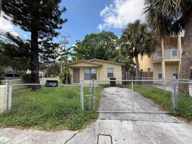a view of a yard with a house and a garden