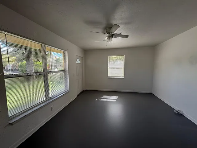 a view of an empty room with a window