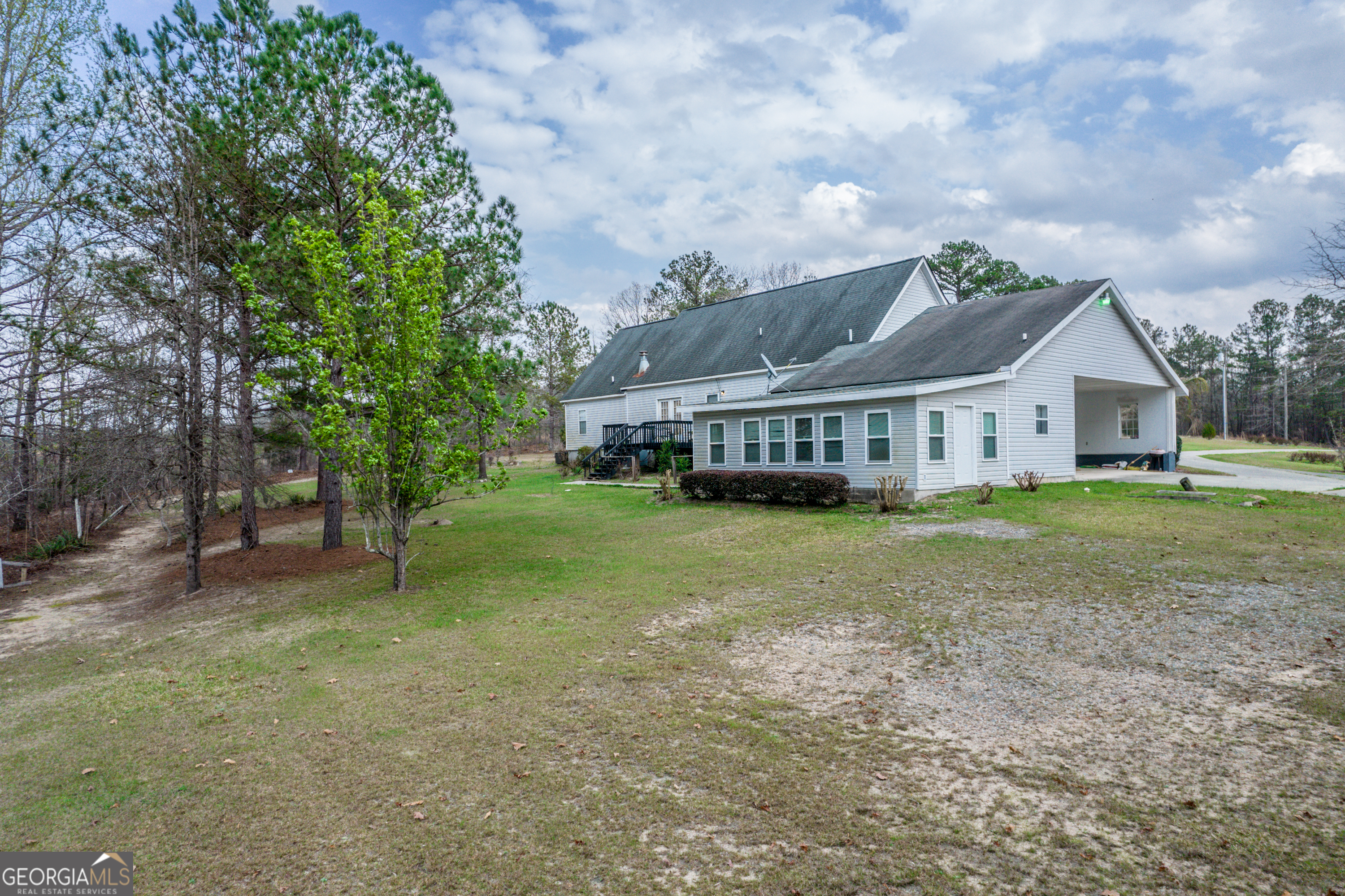 621 Highway 22 Sparta, GA 31087 - Photo 13 of 42 a view of a house with a big yard and large trees