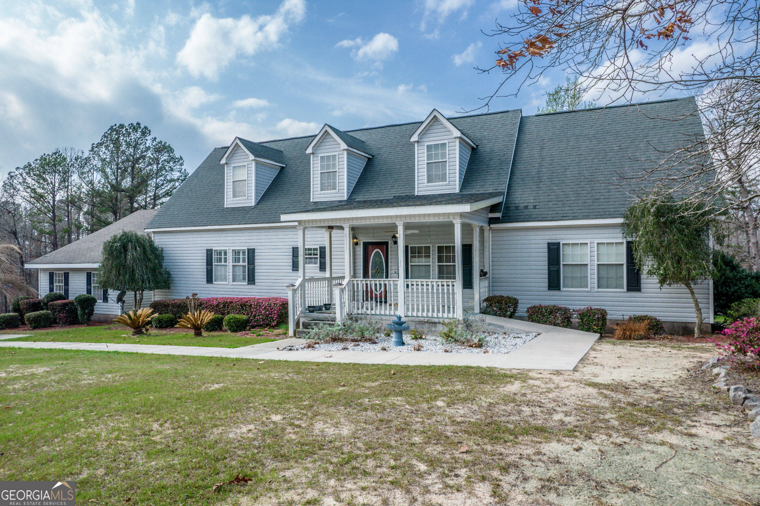 621 Highway 22 Sparta, GA 31087 - Photo 2 of 42 a view of a house with a yard and sitting area