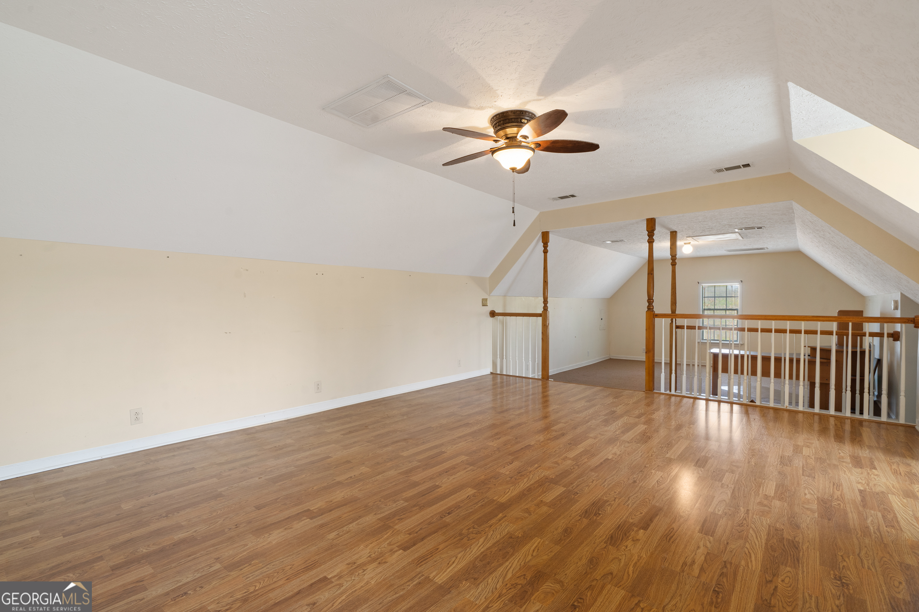 621 Highway 22 Sparta, GA 31087 - Photo 34 of 42 a view of empty room with wooden floor and fan