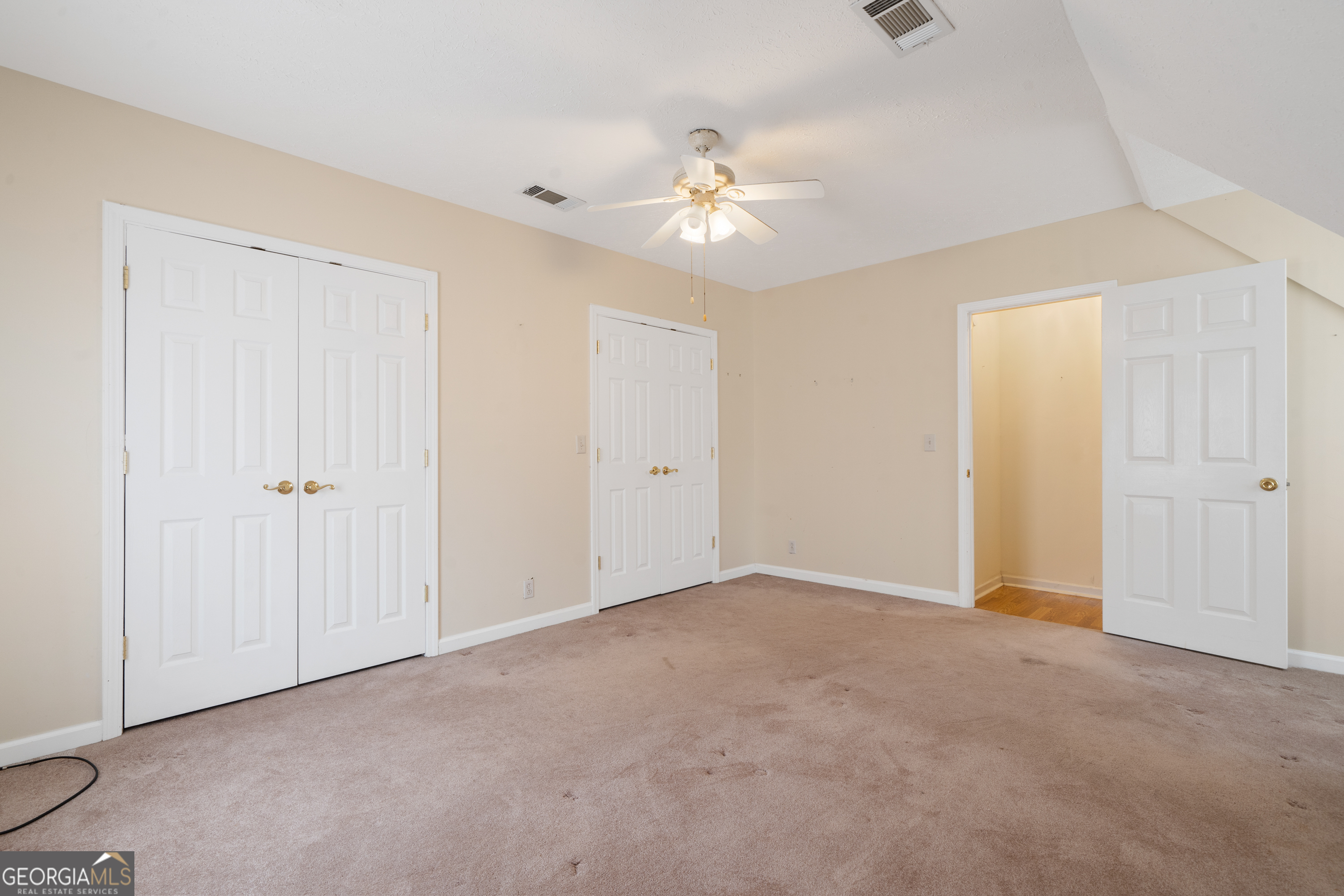 621 Highway 22 Sparta, GA 31087 - Photo 37 of 42 a view of an empty room with a ceiling fan