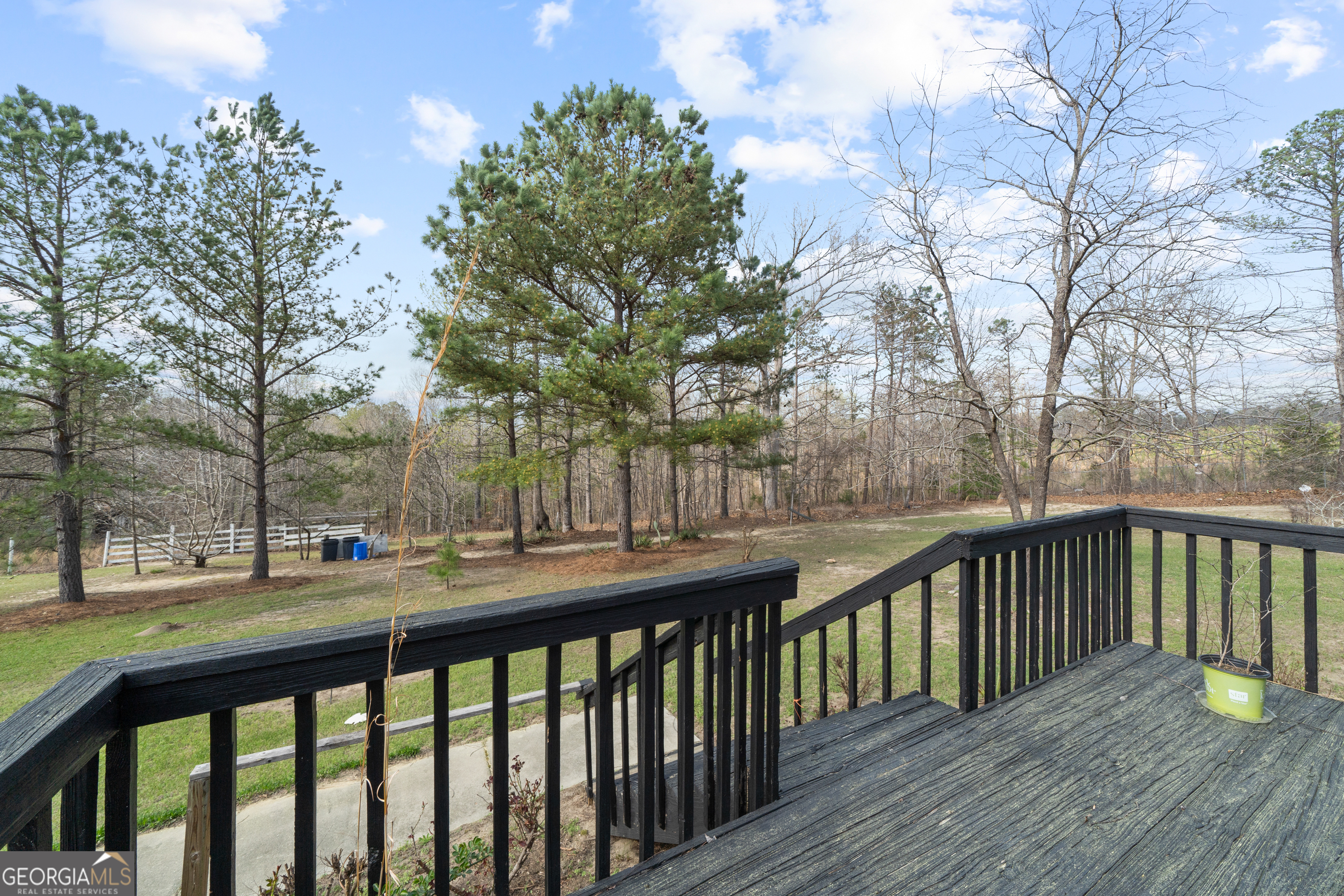 621 Highway 22 Sparta, GA 31087 - Photo 38 of 42 a balcony with wooden floor and trees
