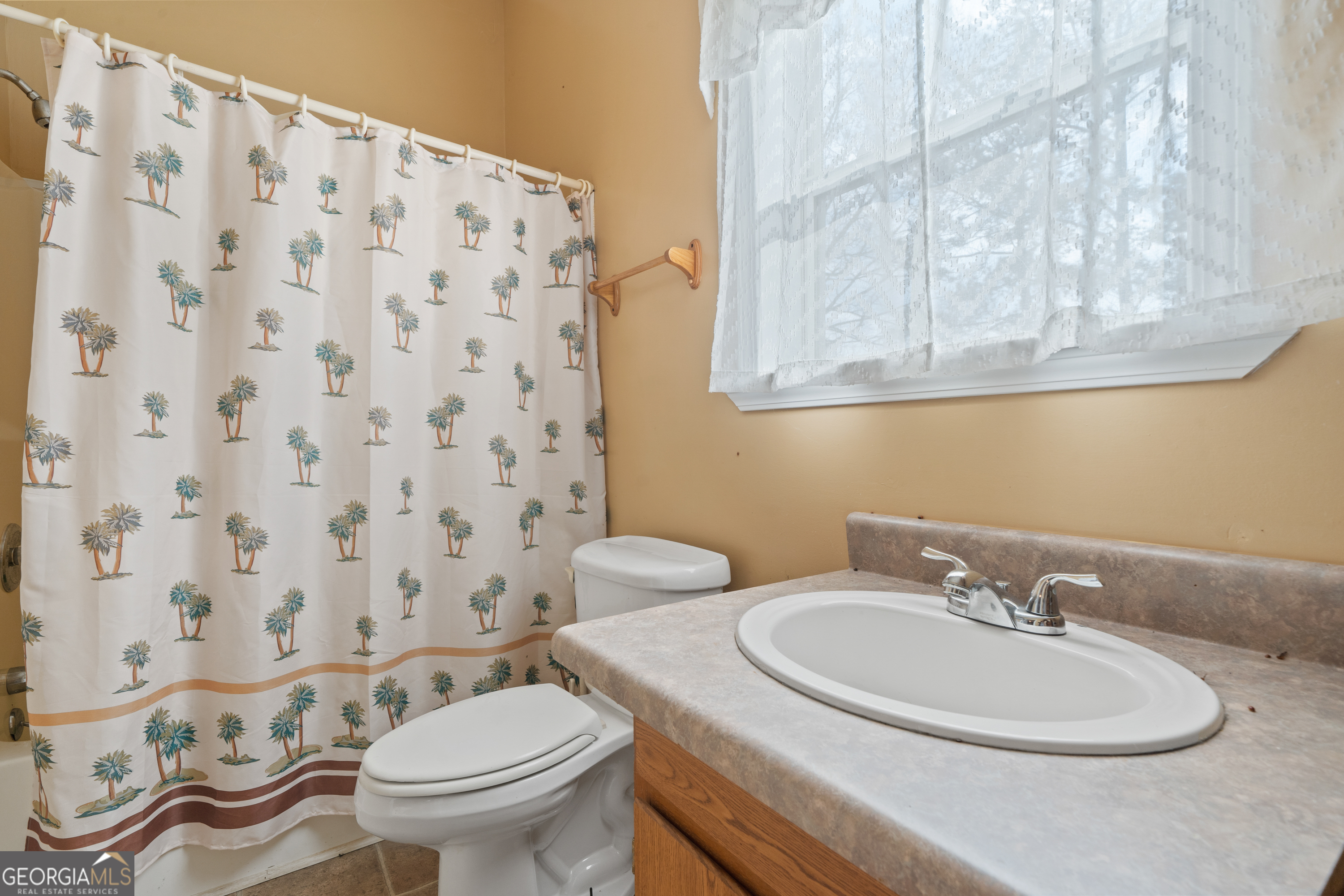 621 Highway 22 Sparta, GA 31087 - Photo 39 of 42 a bathroom with a sink and a mirror