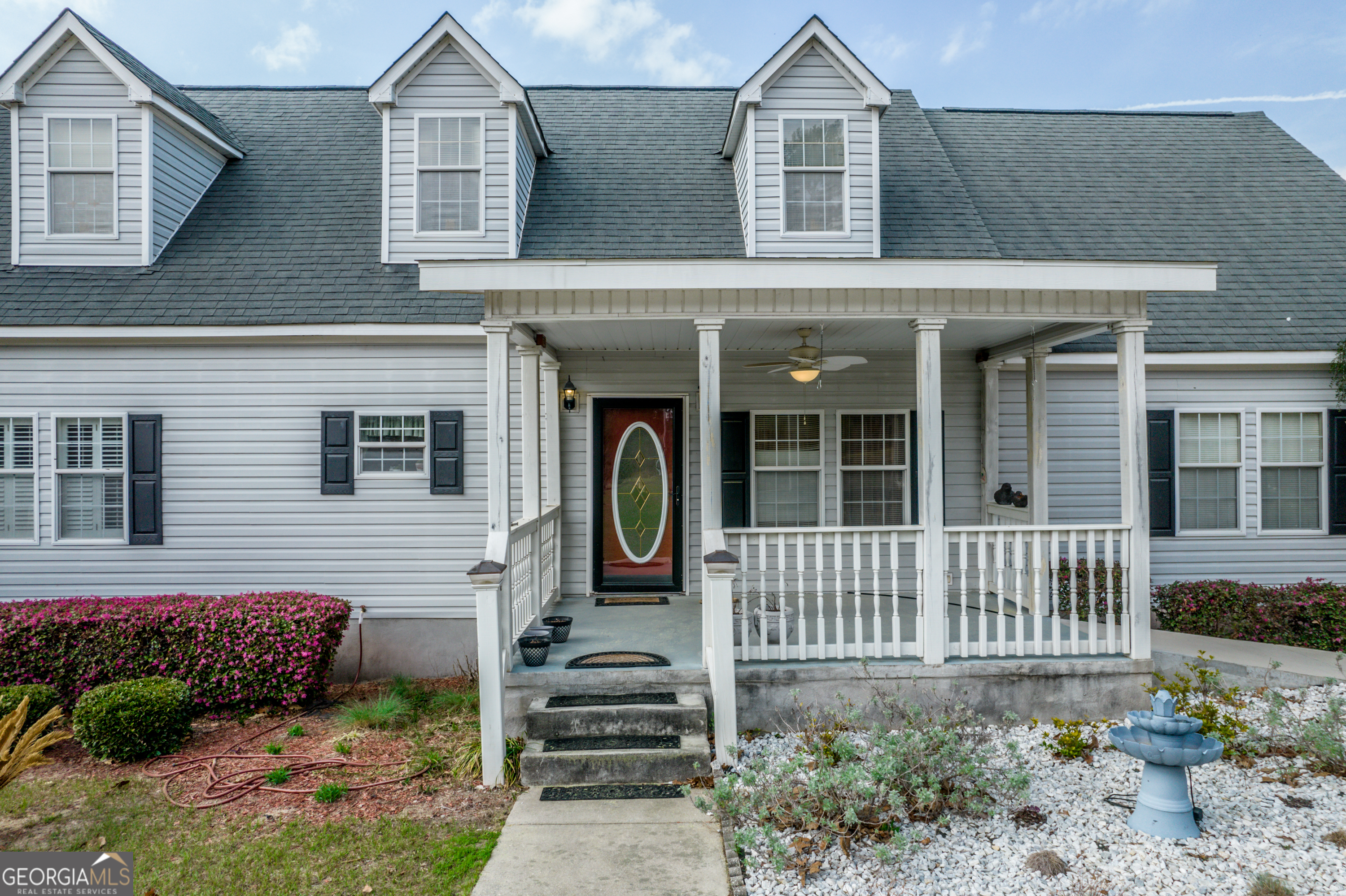621 Highway 22 Sparta, GA 31087 - Photo 7 of 42 front view of a house with a yard