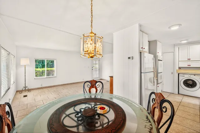 a utility room with sink dryer and washer