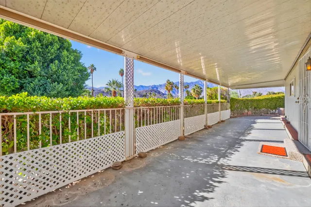 a view of railway station with wooden fence