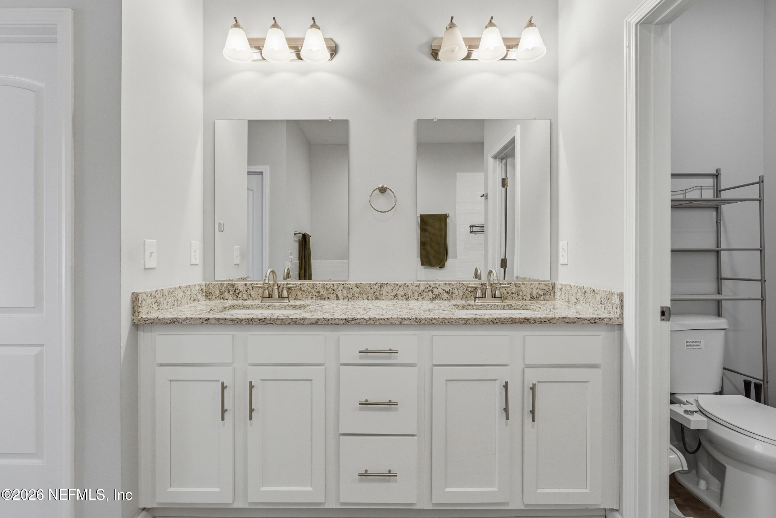 94 Sorrel Street Middleburg, FL 32068 - Photo 23 of 40 a bathroom with a granite countertop sink and a mirror