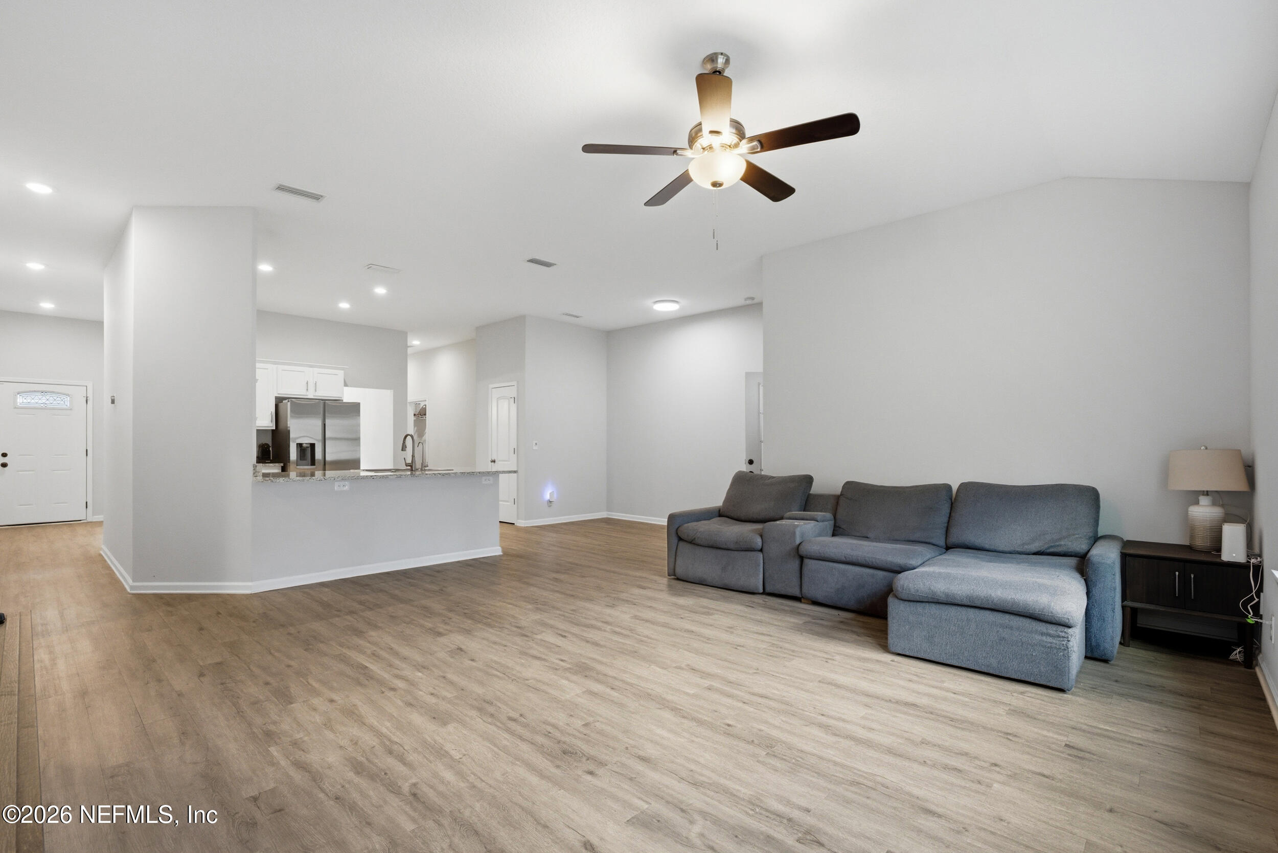 94 Sorrel Street Middleburg, FL 32068 - Photo 26 of 40 a living room with furniture and a wooden floor