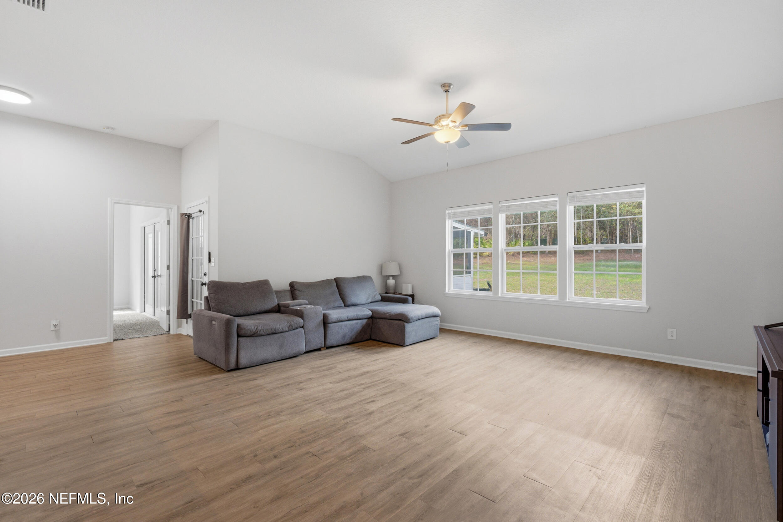 94 Sorrel Street Middleburg, FL 32068 - Photo 27 of 40 a living room with furniture and a large window