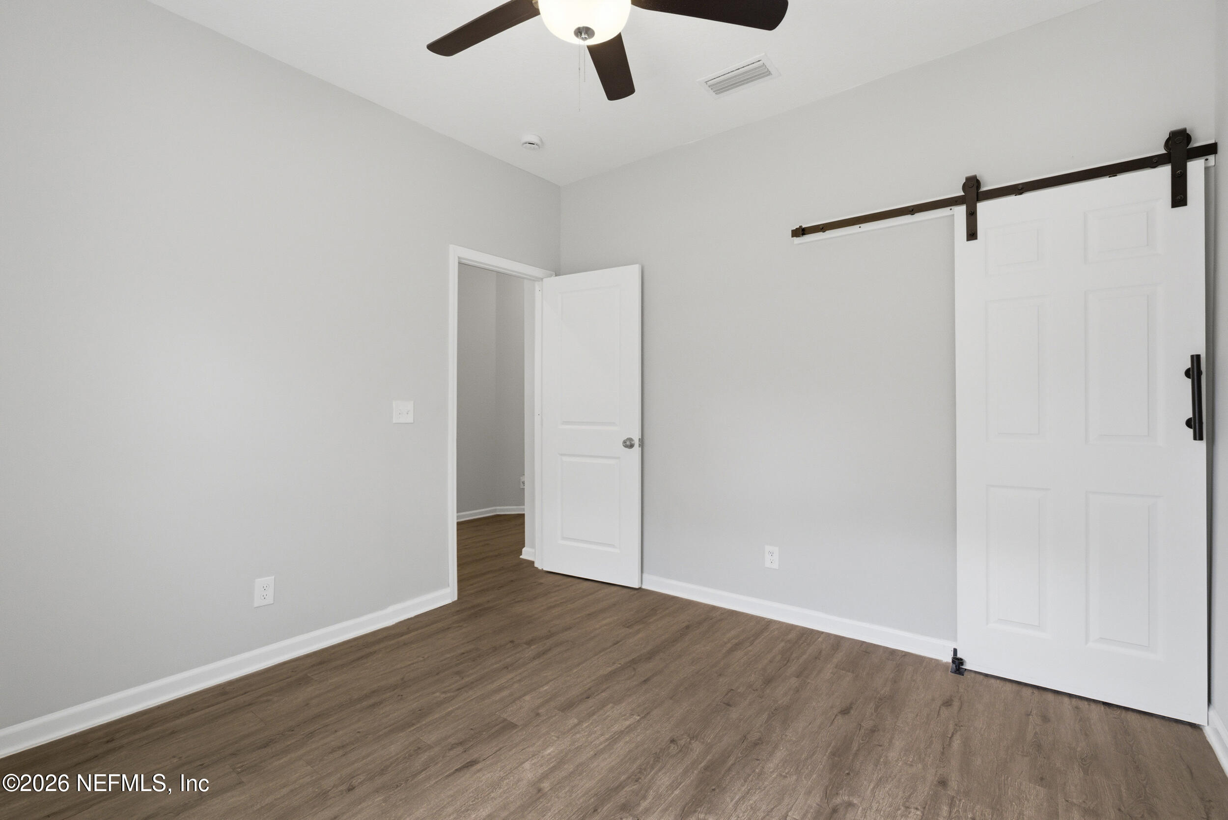 94 Sorrel Street Middleburg, FL 32068 - Photo 6 of 40 a view of an empty room with wooden floor