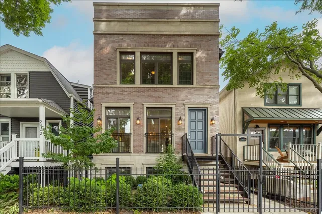 front view of a house with a tree