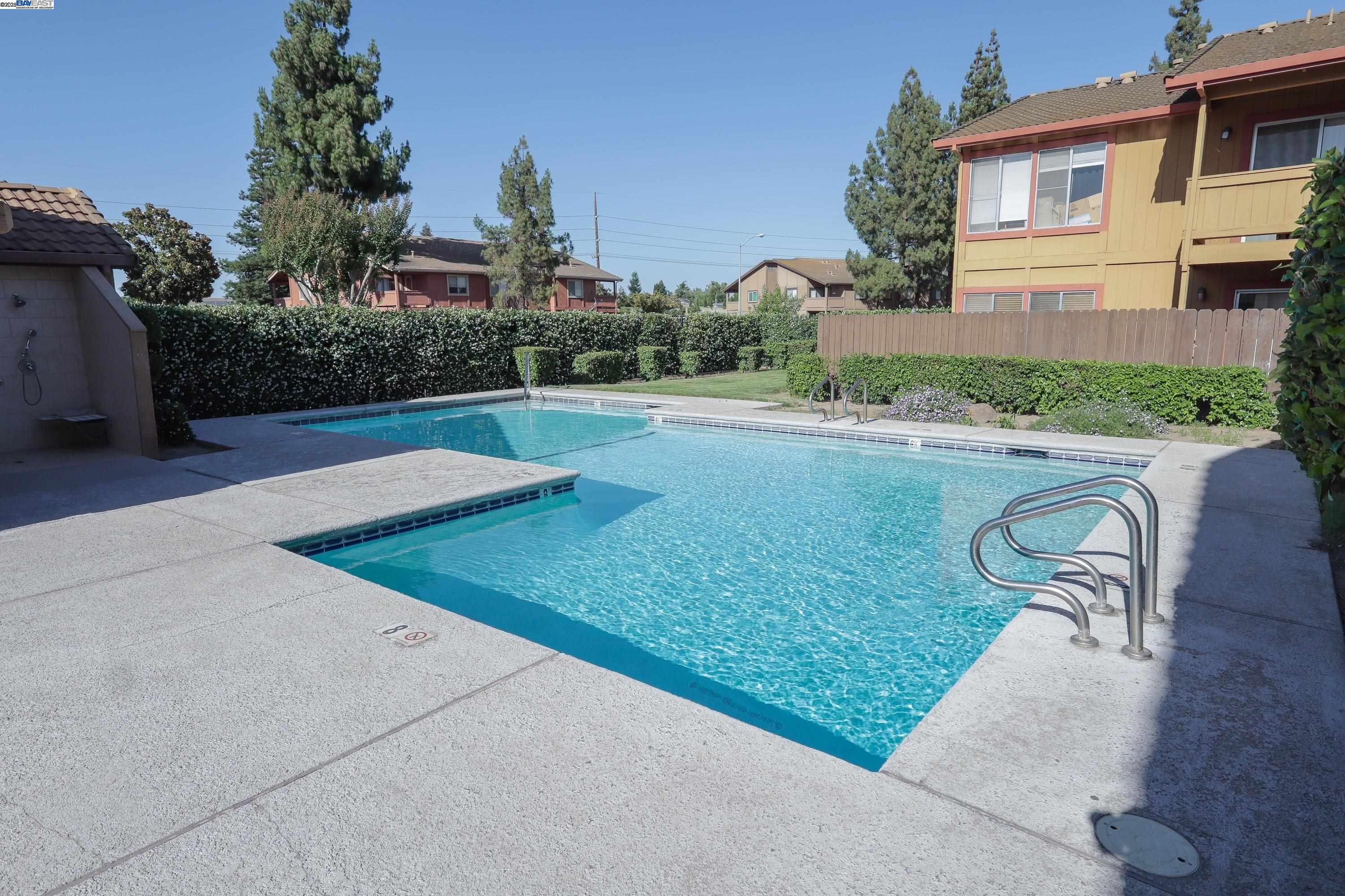 480 Cherry Lane, Unit E Manteca, CA 95337 - Photo 9 of 11 a view of a backyard with a garden and plants