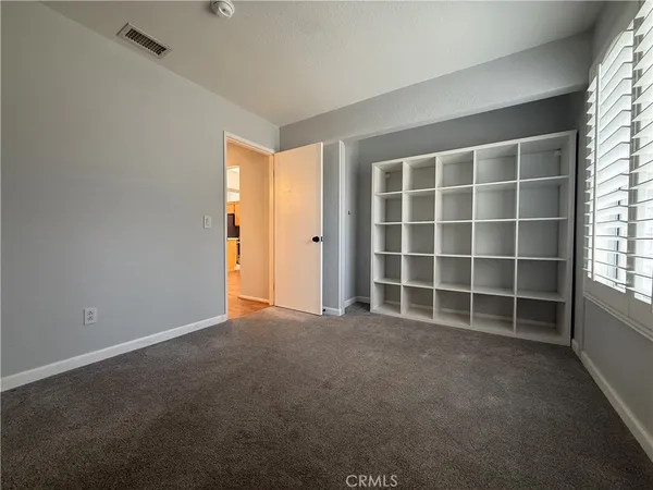 a view of empty room with windows