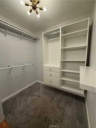a view of an empty walk in closet