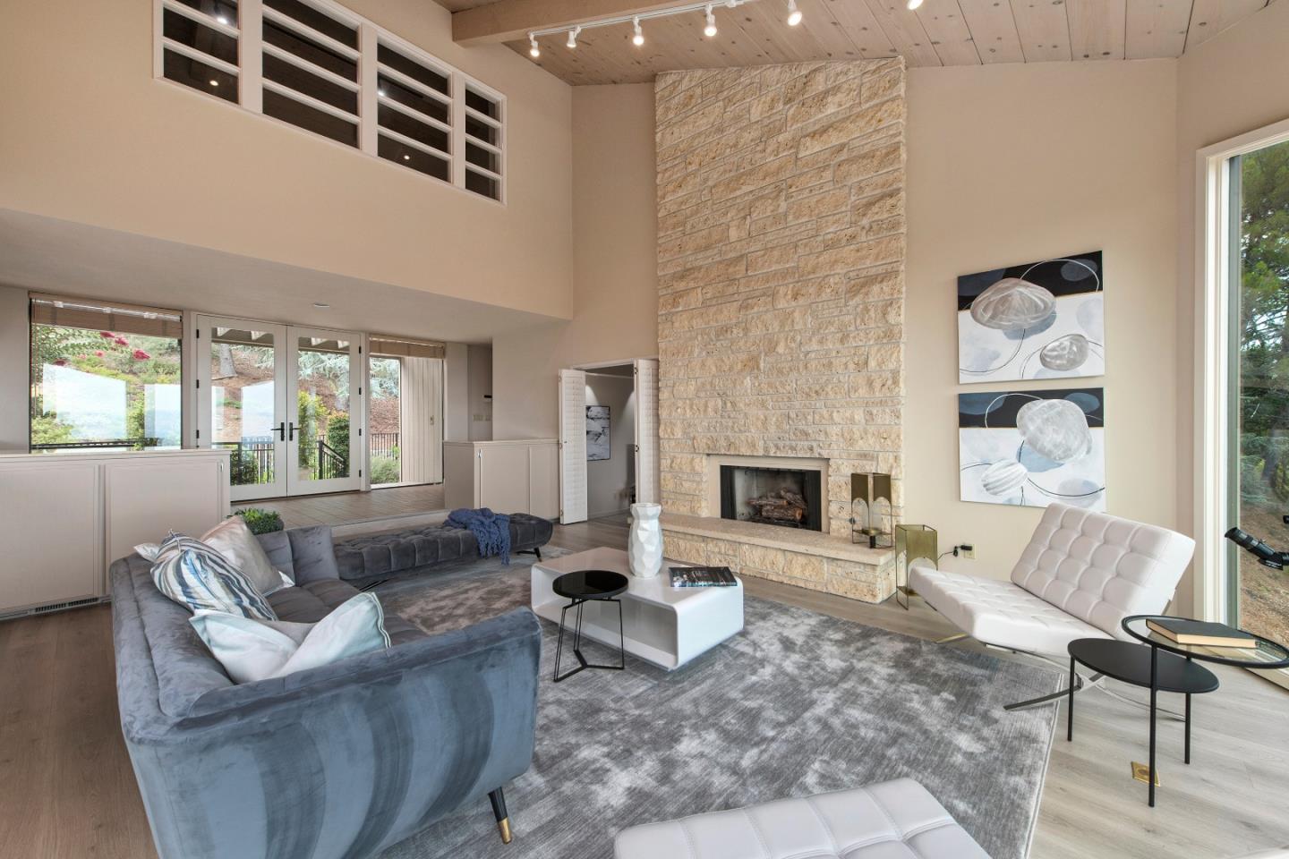 22365 Regnart Road Cupertino, CA 95014 - Photo 11 of 54 a living room with furniture and a fireplace