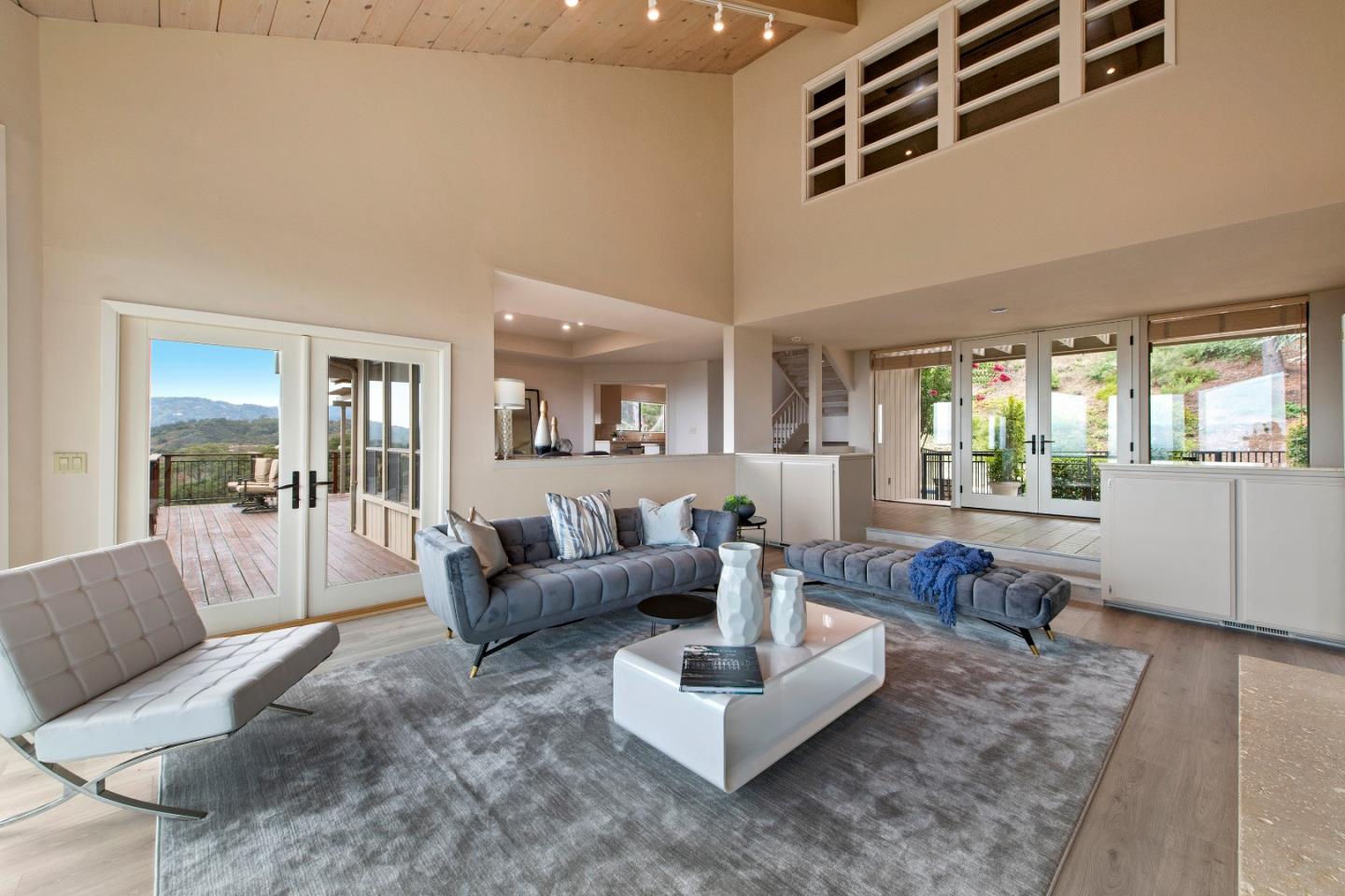 22365 Regnart Road Cupertino, CA 95014 - Photo 12 of 54 a living room with furniture and a large window