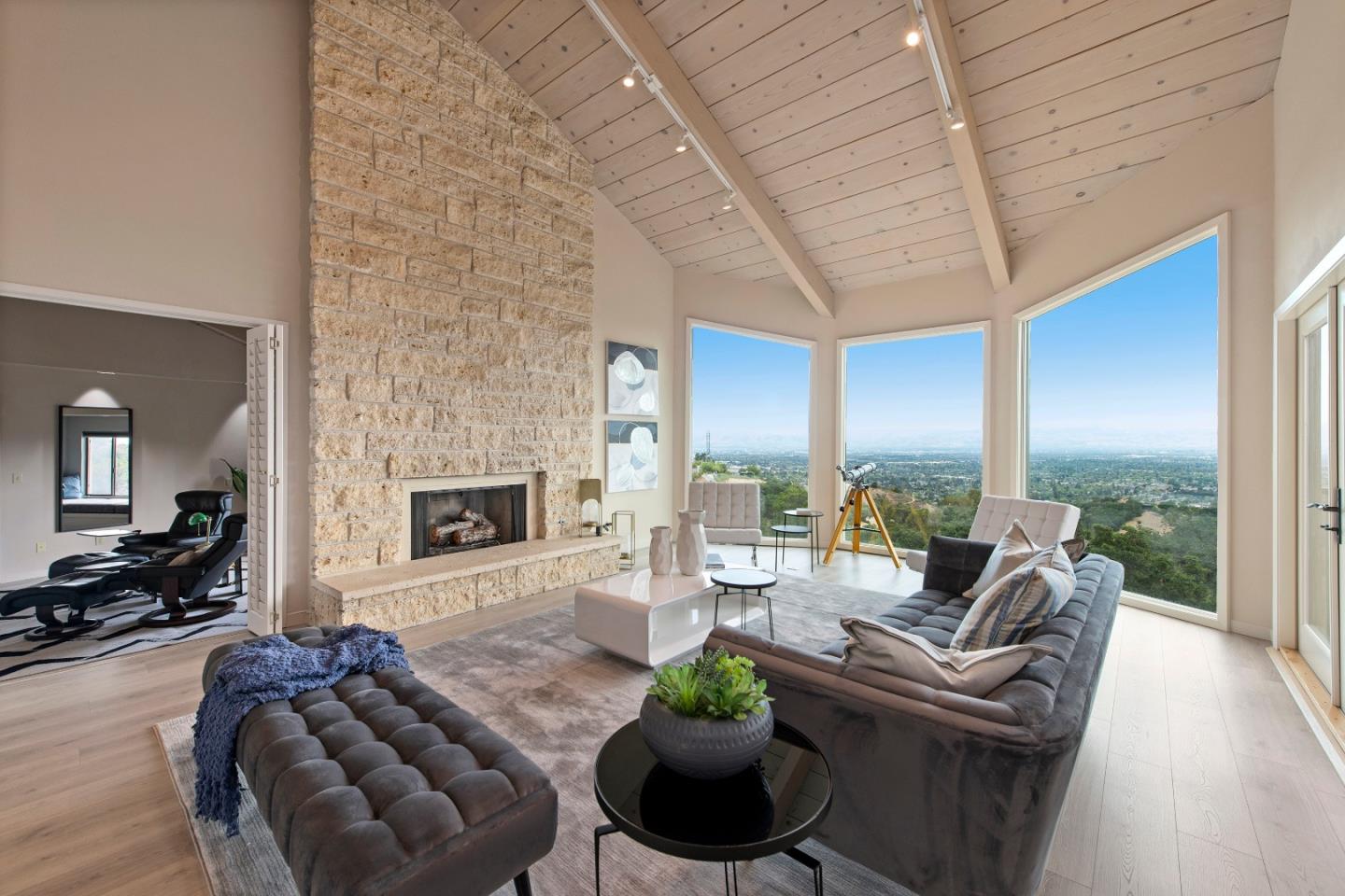 22365 Regnart Road Cupertino, CA 95014 - Photo 13 of 54 a living room with furniture potted plant floor to ceiling windows and a fireplace